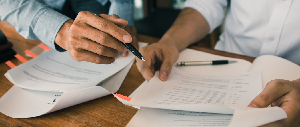 people reviewing paper work