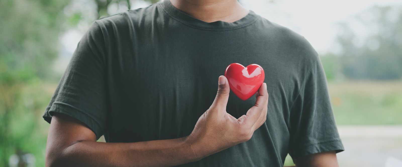 person holding heart stone