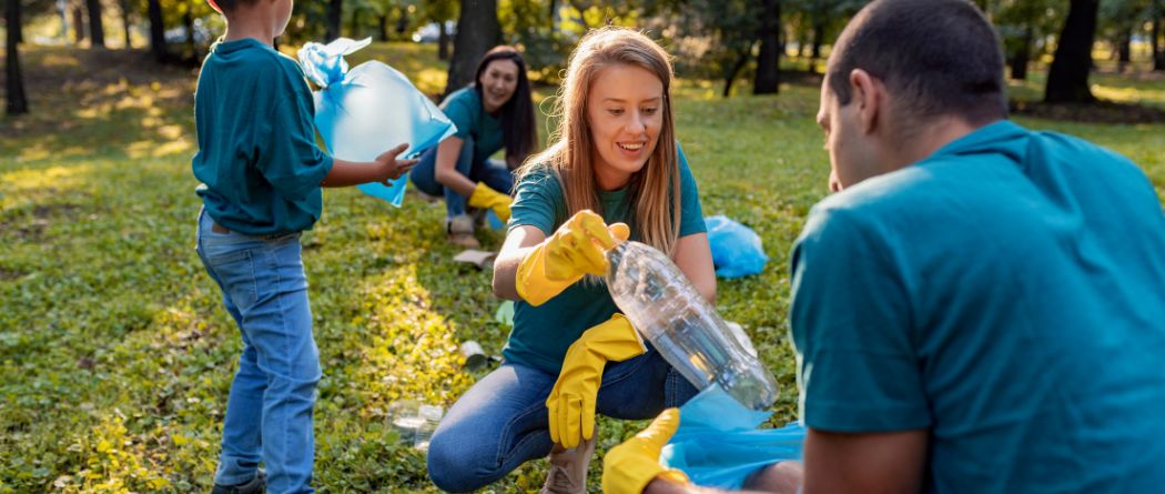 family cleaning up litter