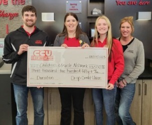 employees with donation check for CMN