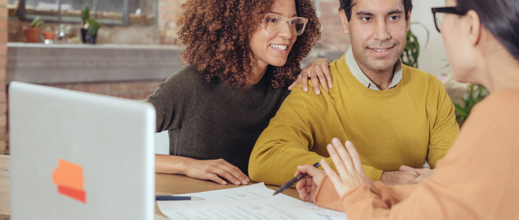 business team talking at laptop