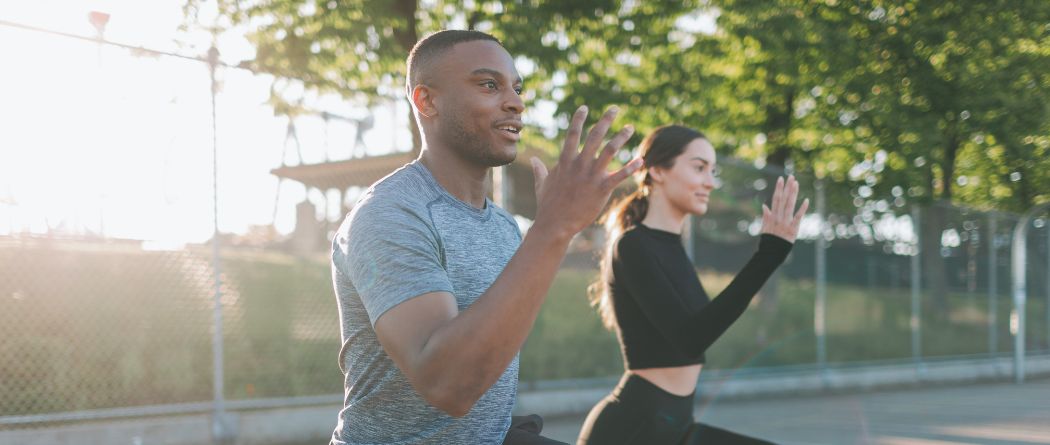 couple working out in park