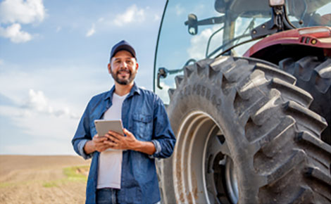 Farmer using his tablet in a field