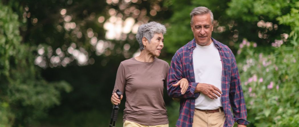 older couple walking in park